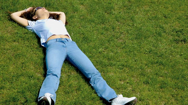 Teenage Girl Lying On Grass